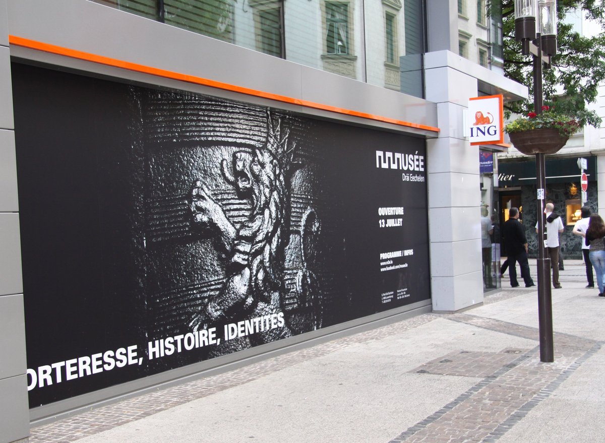 Big Event Poster of Musée Dräi Eechelen on a wall in Luxembourg City