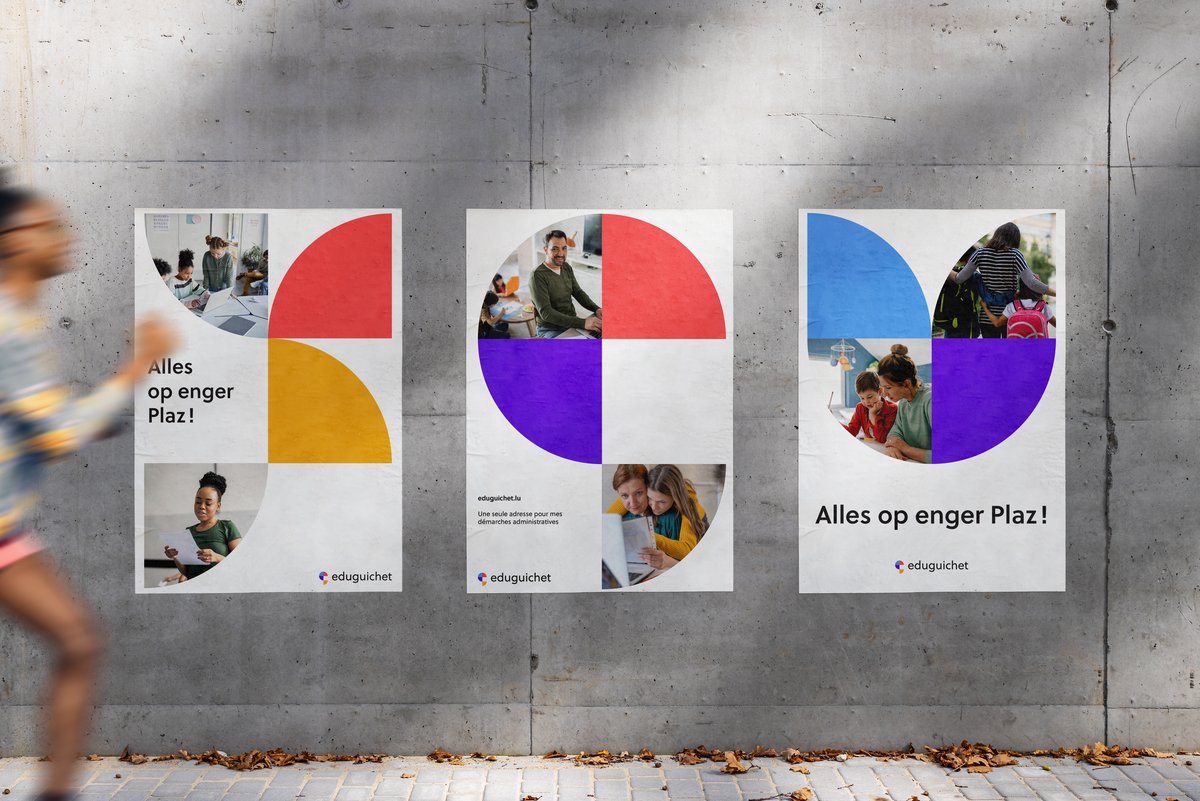 Poster walls featuring eduguichet's new branding in the street