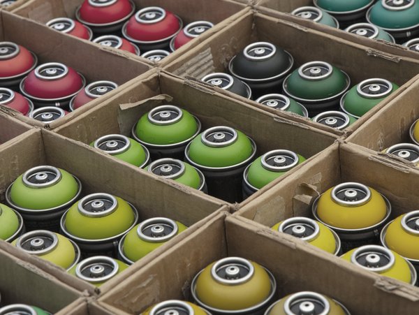 Spraycans in a box