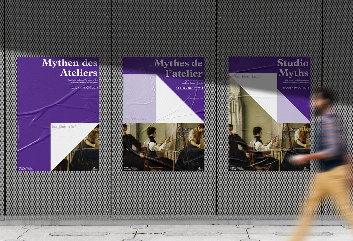 3 poster variants for the same event displayed on a metal wall